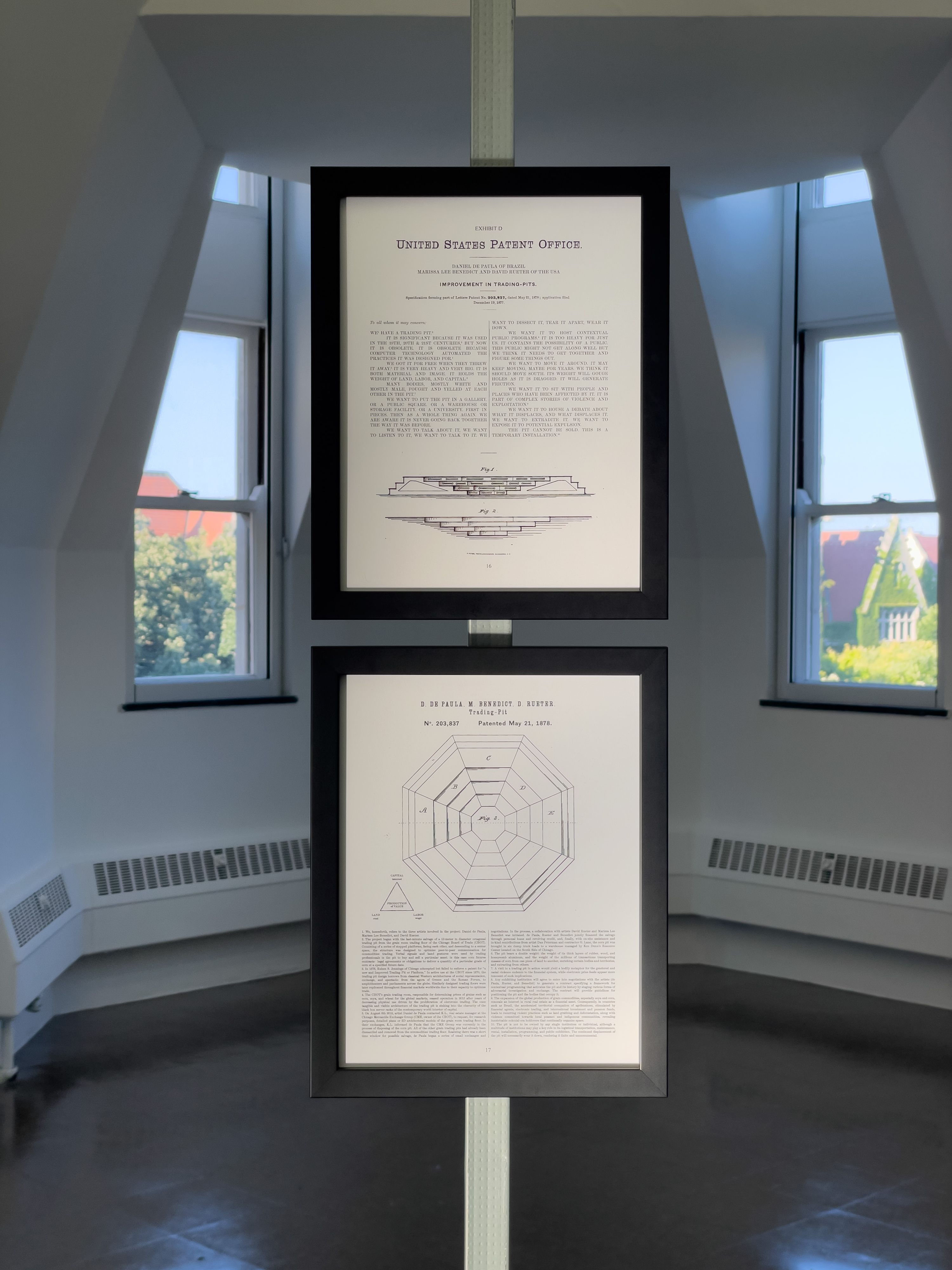 Marissa Lee Benedict, Daniel de Paula, and David Rueter, under cover of a solid object, 2022, Relief in floor wax, excerpt from the artists’ contract for the work deposition (2021), debris removed from ventilation ducts under the Chicago Board of Trade’s former corn futures trading floor, gelatin silver print (circa 1974, photographer unknown; Special Collections and University Archives, University of Illinois, Chicago)., In 2018, Rueter, Benedict, and de Paula acquired a used trading pit from the Chicago Board of Trade, now obsolete as trading goes digital. A huge octagon with seven tiered levels where traders bought and sold corn futures, the pit itself has since traveled to Sao Paolo and back to Chicago. Here it appears only as an outline at full scale, a ghost of itself that questions what can be distilled from a thing’s remnants. A pair of documents and a photograph appear like footnotes above the floor and in the opposite corner of the gallery.